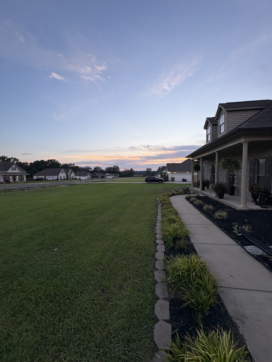 Large green lawn beside a home